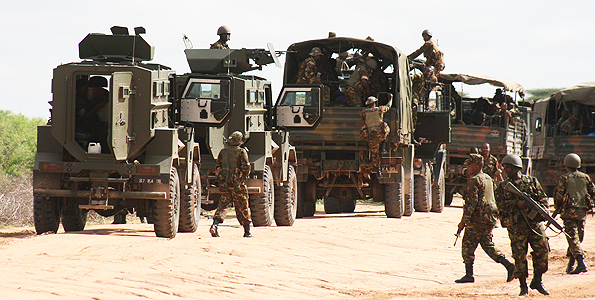 Kenya Army column trucks lead Puma M26 mine protected vehicles follow