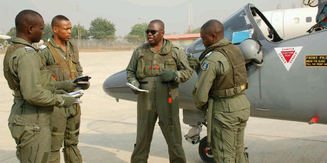 Nigerian Air Force Alpha Jet pilots receive a pre-flight briefing from Air Component Commander, Air Vice Marshal Tayo Oguntonyibo(2nd right)prepare to take off to Niger from Abuja